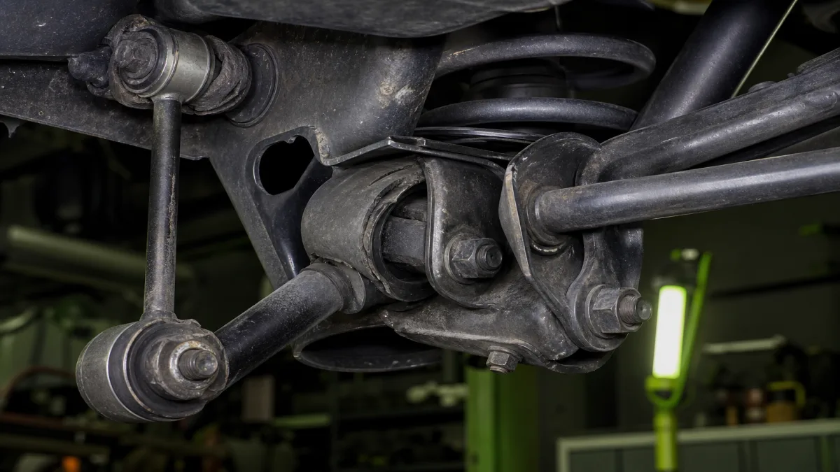 Rear suspension components showing wear patterns from city and highway driving, 1200x675